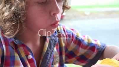 Young Boy Eating Food