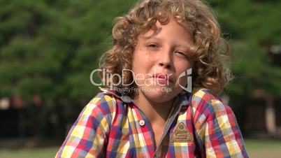 Curly Blonde Boy Pointing