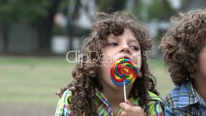 Disabled Boy Eating Lollipop Candy