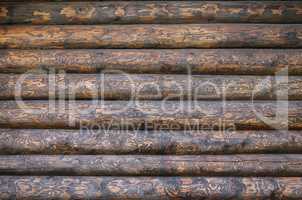 Wooden wall from logs as a background texture