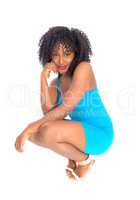 African American woman crouching.