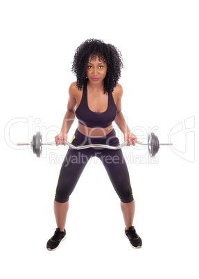 African American woman weight lifting.