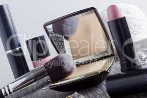 Powder box with mirror and cosmetic brush