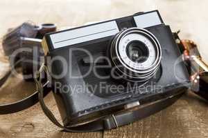 Vintage photo camera and blank film strip
