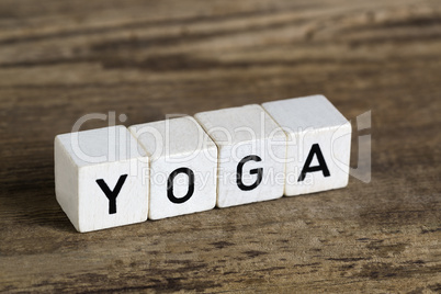 The word yoga written in cubes