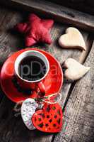 Cup decorated with wooden hearts