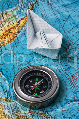 outdated marine compass on a topographic map