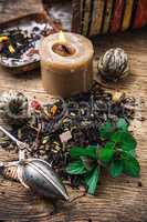 tea brew with lime and mint on wooden background