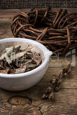 licorice rolled in coil on wooden background