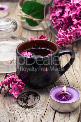 fragrant tea and a branch of lilac