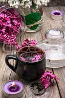 fragrant tea and a branch of lilac