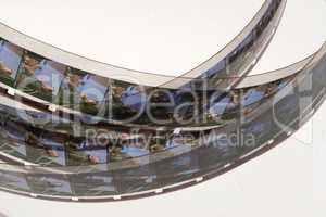 Old positive 16 mm film strip on white background