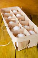 Chicken eggs in a wooden box