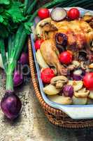 baked whole chicken in vegetables