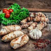 set fried meat sausages on wooden background