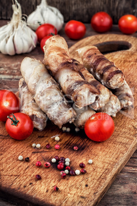 set fried meat sausages on wooden background