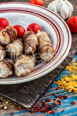 set fried meat sausages on wooden background