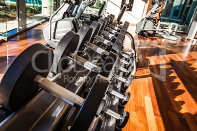 Dumbbells in the gym. Gym interior with equipment