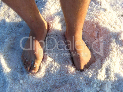 man's legs standing in the healing salt