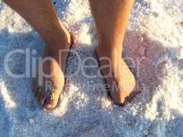 man's legs standing in the healing salt