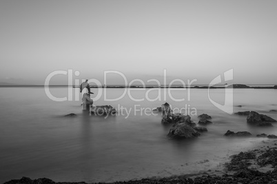 long exposure of statue of dolphin in the water in sardinia - it