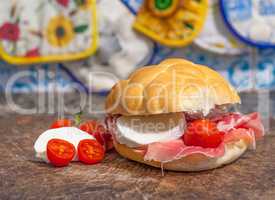 sanwich with ham, little tomatoes and mozzarella