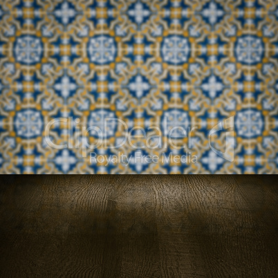 Wood table top and blur vintage ceramic tile pattern wall