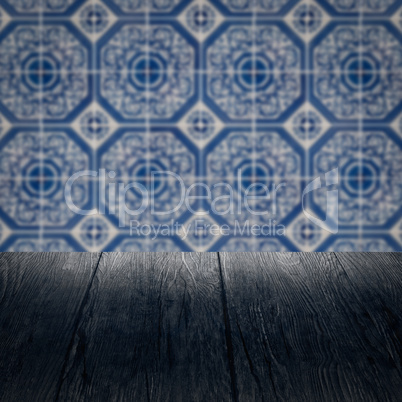 Wood table top and blur vintage ceramic tile pattern wall