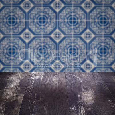 Wood table top and blur vintage ceramic tile pattern wall Wood table top and blur vintage ceramic tile pattern wall