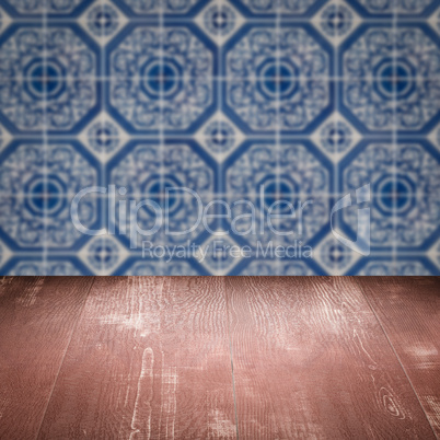 Wood table top and blur vintage ceramic tile pattern wall