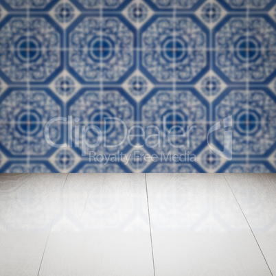 Wood table top and blur vintage ceramic tile pattern wall