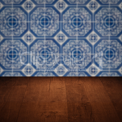 Wood table top and blur vintage ceramic tile pattern wall