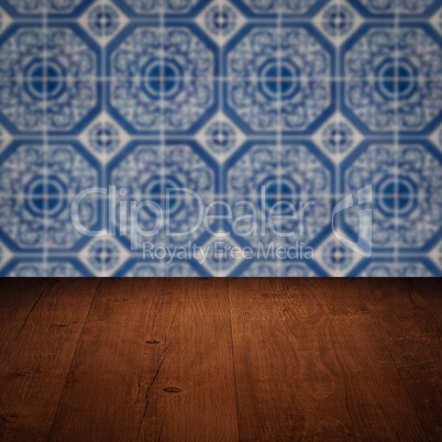 Wood table top and blur vintage ceramic tile pattern wall