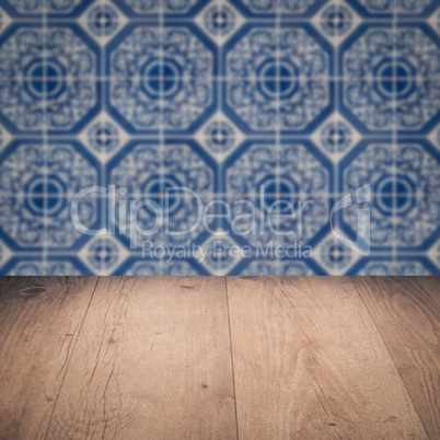 Wood table top and blur vintage ceramic tile pattern wall