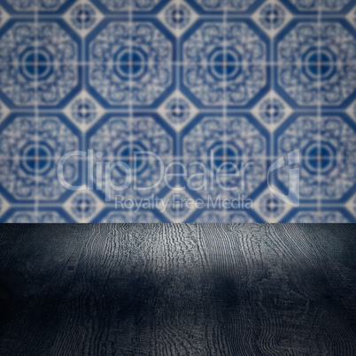 Wood table top and blur vintage ceramic tile pattern wall Wood table top and blur vintage ceramic tile pattern wall