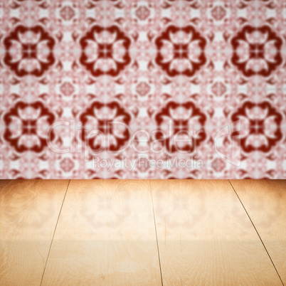 Wood table top and blur vintage ceramic tile pattern wall