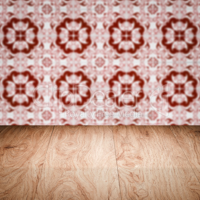 Wood table top and blur vintage ceramic tile pattern wall