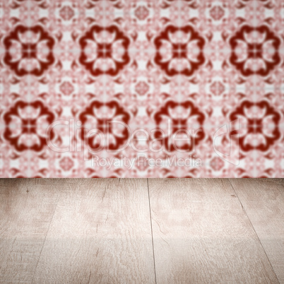 Wood table top and blur vintage ceramic tile pattern wall