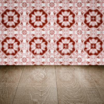 Wood table top and blur vintage ceramic tile pattern wall