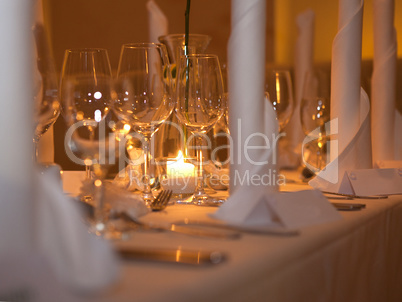 Wine glasses at a laid table