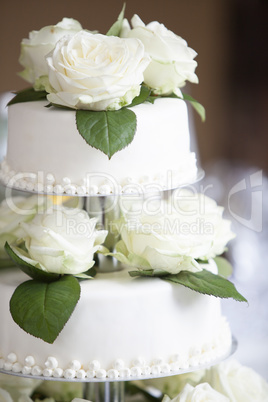 White wedding cake with roses