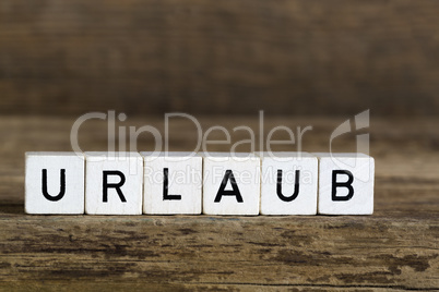 The german word holidays written in cubes