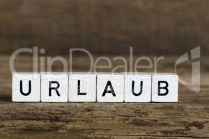 The german word holidays written in cubes