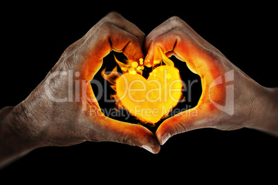 Composite image of couple making heart shape with hands