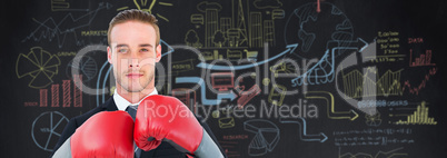 Composite image of businessman with boxing gloves