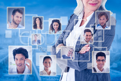 Composite image of businesswoman standing arms crossed on white