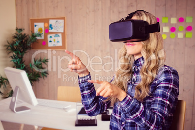 Composite image of pretty casual worker using oculus rift