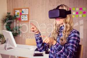Composite image of pretty casual worker using oculus rift