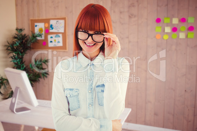 Composite image of portrait of a hipster woman front of post-it