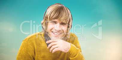 Composite image of smiling hipster businessman using headset